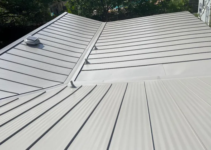 Solar attic fan installed on a metal roof for Roof Ventilation in Adairsville
